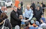 Illustrative:  Moshe Barkat (C), Police commander of the Judea and Samaria District attends a ceremony for the Jewish holiday of Tu Bishvat in the West Bank settlement of Efrat on February 11, 2020. (Gershon Elinson/Flash90)