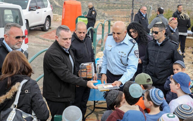 Illustrative:  Moshe Barkat (C), Police commander of the Judea and Samaria District attends a ceremony for the Jewish holiday of Tu Bishvat in the West Bank settlement of Efrat on February 11, 2020. (Gershon Elinson/Flash90)