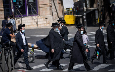 People walk in the ultra-Orthodox neighborhood of Mea Shearim, Jerusalem, October 1, 2020 (Yonatan Sindel/Flash90)