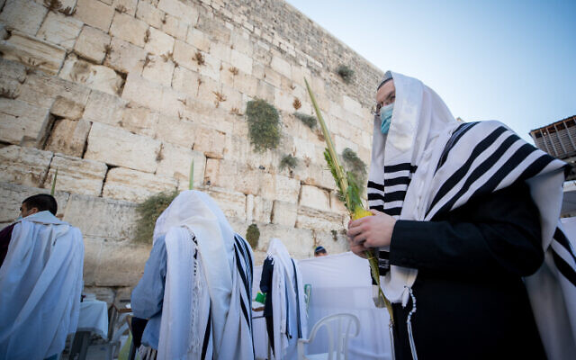 Worshipers pray in front of the Western Wall in Jerusalem's Old City, October 5, 2020. (Yonatan Sindel/Flash90) Worshipers pray in front of the Western Wall in Jerusalem's Old City, October 5, 2020. (Yonatan Sindel/Flash90)