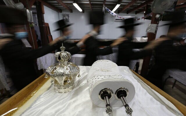Illustrative: Ultra-Orthodox Jews dance during Simchat Torah celebrations, October 10, 2020 (David Cohen/Flash90) Illustrative: Ultra-Orthodox Jews dance during Simchat Torah celebrations, October 10, 2020 (David Cohen/Flash90)