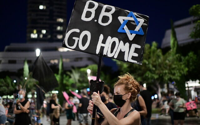 Activists protest against Prime Minister Benjamin Netanyahu at Dizengoff Square Tel Aviv, on October 10, 2020. (Tomer Neuberg/ Flash90) Activists protest against Prime Minister Benjamin Netanyahu at Dizengoff Square Tel Aviv, on October 10, 2020. (Tomer Neuberg/ Flash90)