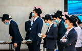 Ultra Orthodox Jews praying in the  town of Bnei Brak on October 14, 2020 (Yossi Aloni/Flash90)