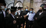 Israeli police argue with ultra-Orthodox worshippers in Miron on October 15, 2020. (David Cohen/FLASH90)