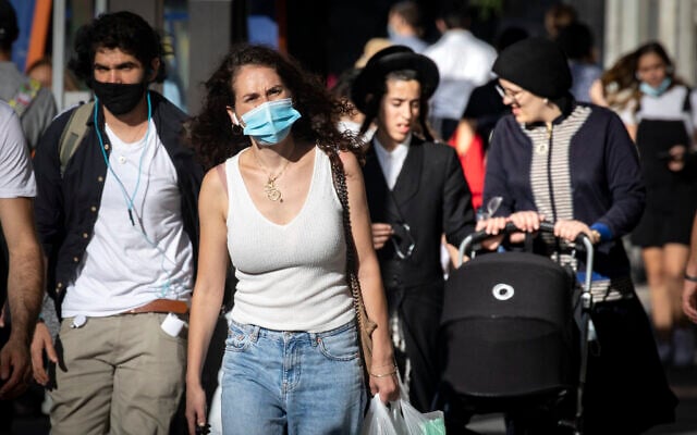 People walk in downtown Jerusalem on October 15, 2020, during a nationwide lockdown. (Olivier Fitoussi/Flash90) People walk in downtown Jerusalem on October 15, 2020, during a nationwide lockdown. (Olivier Fitoussi/Flash90)