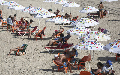 Israelis on the beach in Tel Aviv on October 18, 2020, as lockdown restrictions were eased. (Miriam Alster/FLASH90) Israelis on the beach in Tel Aviv on October 18, 2020, as lockdown restrictions were eased. (Miriam Alster/FLASH90)