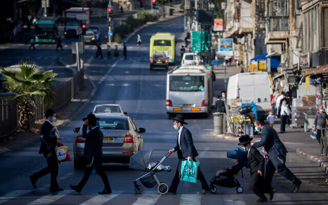 Illustrative: Ultra-Orthodox Jews walk in Jerusalem on October 19, 2020. (Yonatan Sindel/Flash90)