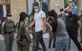 Israeli border police officers patrol on Jaffa Street in downtown Jerusalem on as Israel steps out of coronavirus lockdown and rolls back restrictions on October 21, 2020. (Nati Shohat/Flash90)