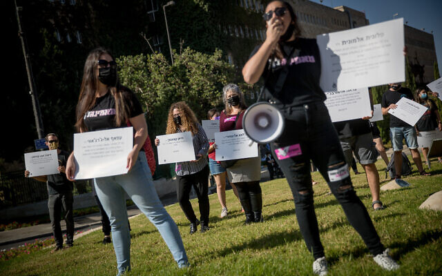 Activists protest against recent cases of violence against women outside the Knesset in Jerusalem, October 21, 2020. (Yonatan Sindel/Flash90) Activists protest against recent cases of violence against women outside the Knesset in Jerusalem, October 21, 2020. (Yonatan Sindel/Flash90)