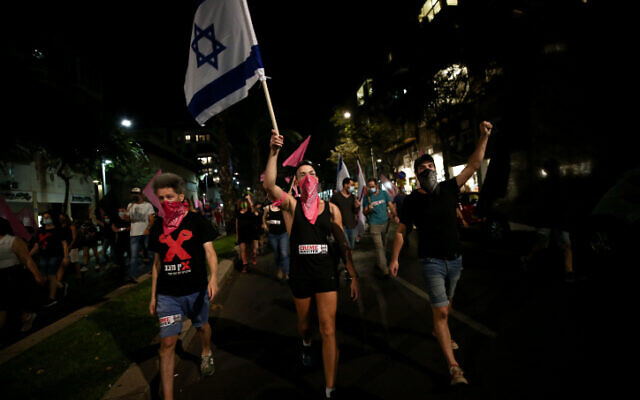 Anti-government protesters march against Prime Minister Benjamin Netanyahu in Tel Aviv on October 22, 2020 (Miriam Alster/Flash90) Anti-government protesters march against Prime Minister Benjamin Netanyahu in Tel Aviv on October 22, 2020 (Miriam Alster/Flash90)