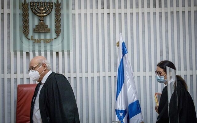 Chief Justice Esther Hayut (R) and High Court Justice Hanan Melcer arrive to a hearing on petitions against the position of alternate prime minister, at the Supreme Court in Jerusalem, October 27, 2020. (Yonatan Sindel/Flash90) Chief Justice Esther Hayut (R) and High Court Justice Hanan Melcer arrive to a hearing on petitions against the position of alternate prime minister, at the Supreme Court in Jerusalem, October 27, 2020. (Yonatan Sindel/Flash90)