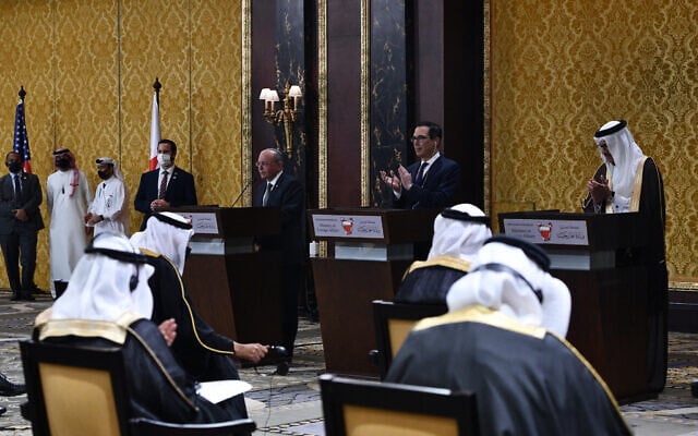 Bahraini Foreign Minister Abdullatif bin Rashid al-Zayani, right, US Secretary of the Treasure Steven Mnuching, center, and Israeli National Security Advisor Meir Ben Shabbat, at the signing ceremony of a peace agreement between Israel and Bahrain, in Manama, October 18, 2020. (Haim Zach / GPO)