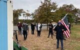 Demonstrators gather to pray mincha before a pro-Trump rally at Marine Park in Brooklyn, New York on October 25, 2020. (Jacob Magid/Times of Israel)