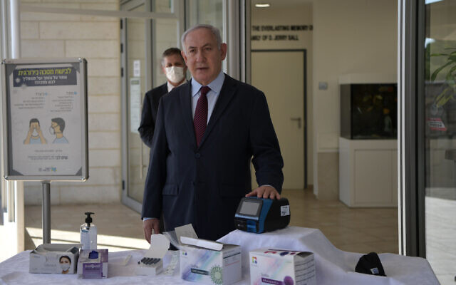 Prime Minister Benjamin Netanyahu taking a 15-minute coronavirus test, October 6, 2020. (Kobi Gideon / GPO) Prime Minister Benjamin Netanyahu taking a 15-minute coronavirus test, October 6, 2020. (Kobi Gideon / GPO)
