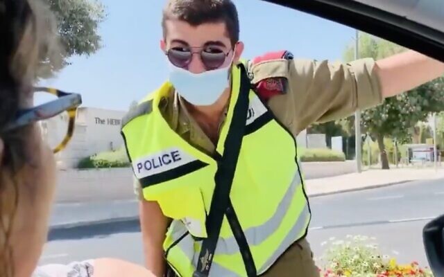 A protester argues with a soldier at a roadblock outside the Knesset in Jerusalem on September 29, 2020. (Screen capture: Twitter) A protester argues with a soldier at a roadblock outside the Knesset in Jerusalem on September 29, 2020. (Screen capture: Twitter)