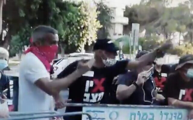 Footage aired by Channel 12 news on October 7, 2020, shows retired air force general Amir Haskel during a protest in August outside the Prime Minister's Residence in Jerusalem. (Screen capture: Twitter) Footage aired by Channel 12 news on October 7, 2020, shows retired air force general Amir Haskel during a protest in August outside the Prime Minister's Residence in Jerusalem. (Screen capture: Twitter)