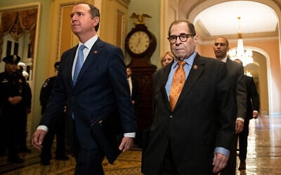 House Intelligence Committee Chairman Adam Schiff, D-Calif., front left, and House Judiciary Committee Chairman, Rep. Jerrold Nadler, D-N.Y., and other House impeachment managers, walk to the Senate chamber on Capitol Hill in Washington, Jan. 16, 2020. (AP Photo/Matt Rourke)