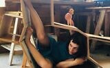 Independent theaters in Israel, such as Habait Theater, returned to performing during the coronavirus, often with one-person performances and audiences of just a few, as in this work of puppeteer Shay Persil, and her play about a woman who lives alone in a small apartment (Courtesy Habait)