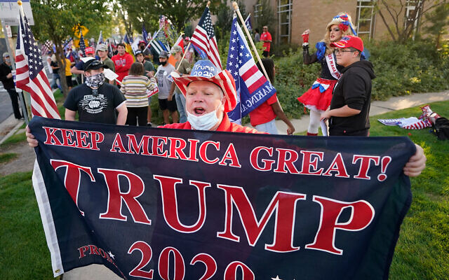 A supporter of US President Donald Trump before the vice presidential debate between Vice President Mike Pence and Sen. Kamala Harris, at the University of Utah in Salt Lake City, Oct. 7, 2020. (AP Photo/Rick Bowmer) A supporter of US President Donald Trump before the vice presidential debate between Vice President Mike Pence and Sen. Kamala Harris, at the University of Utah in Salt Lake City, Oct. 7, 2020. (AP Photo/Rick Bowmer)