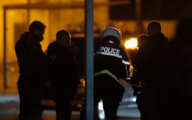 French police officers gather outside a high school after a history teacher who opened a discussion with students on caricatures of Islam's Prophet Muhammad was beheaded in Conflans-Saint-Honorine, north of Paris, October 16, 2020. (AP Photo/Michel Euler) French police officers gather outside a high school after a history teacher who opened a discussion with students on caricatures of Islam's Prophet Muhammad was beheaded in Conflans-Saint-Honorine, north of Paris, October 16, 2020. (AP Photo/Michel Euler)