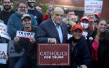 Former New York mayor Rudy Giuliani poses with Trump supporters during a Columbus Day gathering at a Trump campaign field office in Philadelphia, Pennsylvania, Oct. 12, 2020. (AP Photo/Jacqueline Larma)