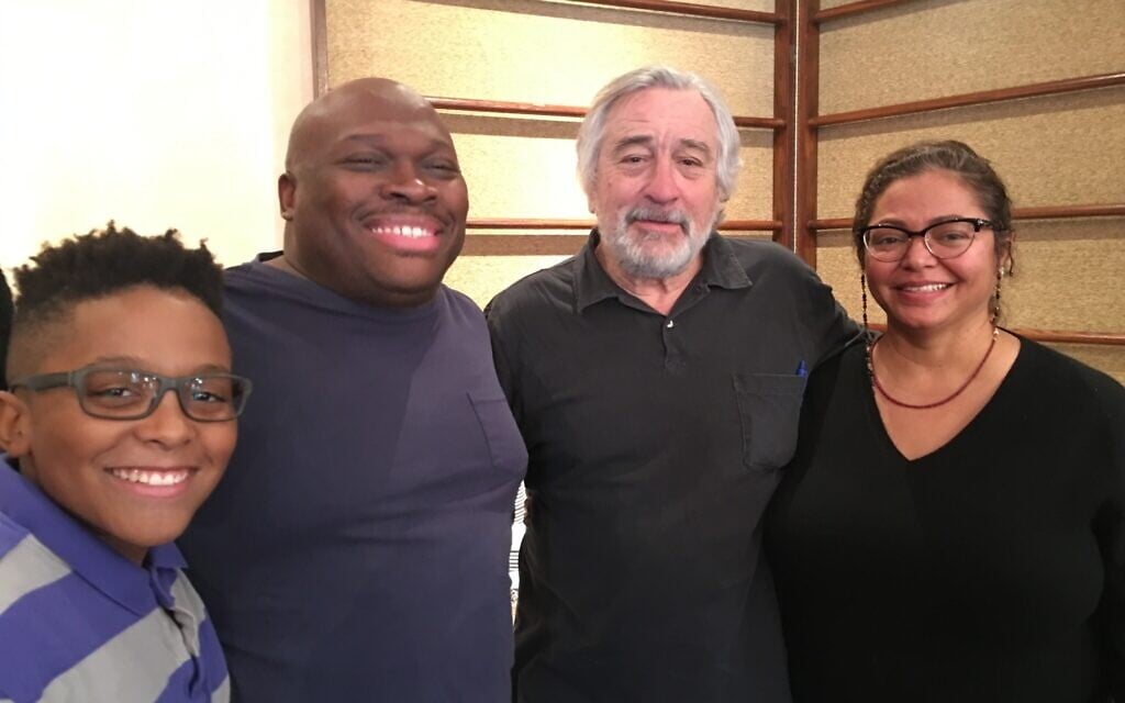 Robert De Niro, center, with 'The War With Grandpa' executive producers, from left, Tre, Marvin, and Rosa Peart. (Courtesy 101 Studios)