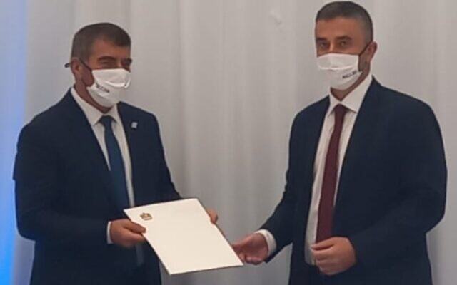 Emirati official Omar Saif Ghobash (R) handing a letter to Foreign Minister Gabi Ashkenazi at a ceremony in Israel on October 20, 2020. (Foreign Ministry) Emirati official Omar Saif Ghobash (R) handing a letter to Foreign Minister Gabi Ashkenazi at a ceremony in Israel on October 20, 2020. (Foreign Ministry)