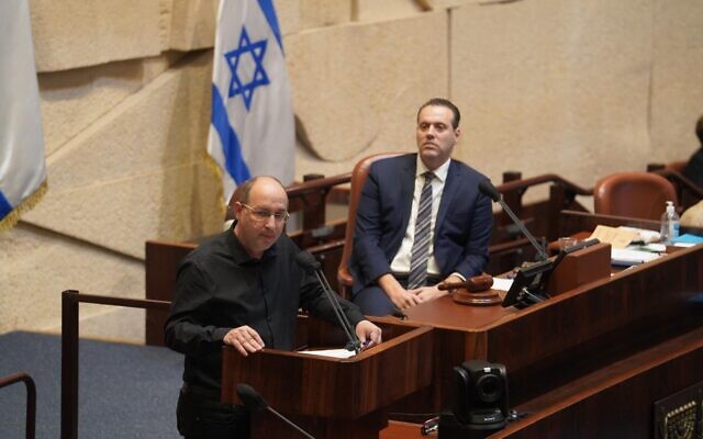 Blue and White Justice Minister Avi Nissenkorn, left, speaks at the Knesset plenum as coalition whip Miki Zohar (Likud) looks on, on October 28, 2020. (Shmulik Grossman/Knesset) Blue and White Justice Minister Avi Nissenkorn, left, speaks at the Knesset plenum as coalition whip Miki Zohar (Likud) looks on, on October 28, 2020. (Shmulik Grossman/Knesset)