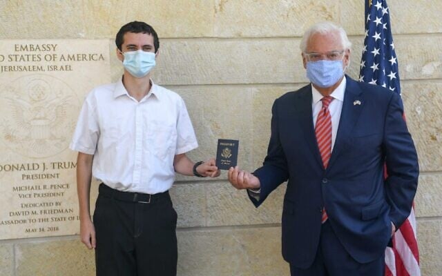 Menachem Zivotofsky (L) is handed the first US passport to have 'Israel' labeled as a place of birth by US Ambassador to Israel David Friedman on October 30, 2020. (US Embassy in Jerusalem) Menachem Zivotofsky (L) is handed the first US passport to have 'Israel' labeled as a place of birth by US Ambassador to Israel David Friedman on October 30, 2020. (US Embassy in Jerusalem)