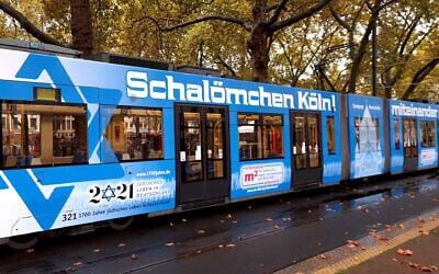 A tram featuring Star of David stickers pulls up to a halt in Cologne, Germany, October 21, 2020. (Courtesy of Synagogue Community Cologne via JTA) A tram featuring Star of David stickers pulls up to a halt in Cologne, Germany, October 21, 2020. (Courtesy of Synagogue Community Cologne via JTA)
