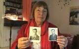 Barbara Brix shows two pictures of her father Peter Kroeger who was part of the 'Einsatzgruppen' Nazi task forces, Schutzstaffel (SS) paramilitary death squads responsible for mass killings, dated 1938 (L) and 1948, in her home in Hamburg, northern Germany, on June 11, 2020 (Marion PAYET / AFP)