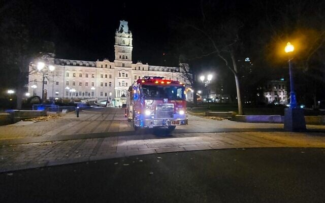 A firefighter truck is parked in front of the National Assembly of Quebec, in Quebec City, early on November 1, 2020, after two people were killed and five wounded by a sword-wielding suspect dressed in medieval clothing (Jordan PROUST / AFP) A firefighter truck is parked in front of the National Assembly of Quebec, in Quebec City, early on November 1, 2020, after two people were killed and five wounded by a sword-wielding suspect dressed in medieval clothing (Jordan PROUST / AFP)