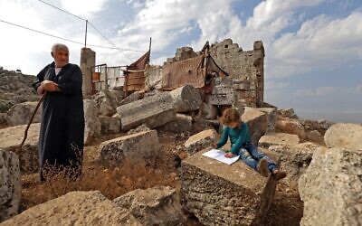 Displaced Syrians are pictured on November 1, 2020, at the UNESCO-listed site of Baqirha not far from the Turkish border, in a region of northwest Syria filled with abandoned Roman and Byzantine settlements (Abdulaziz ketaz / AFP)