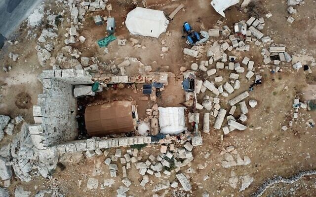 An aerial view shows a makeshift camp of displaced Syrians on November 1, 2020 at Byzantine ruins in the area of Baqirha not far from the Turkish border, in a region of northwest Syria filled with abandoned Byzantine settlements called the Dead Cities, some of which are UNESCO-listed. (Abdulaziz Ketaz / AFP)