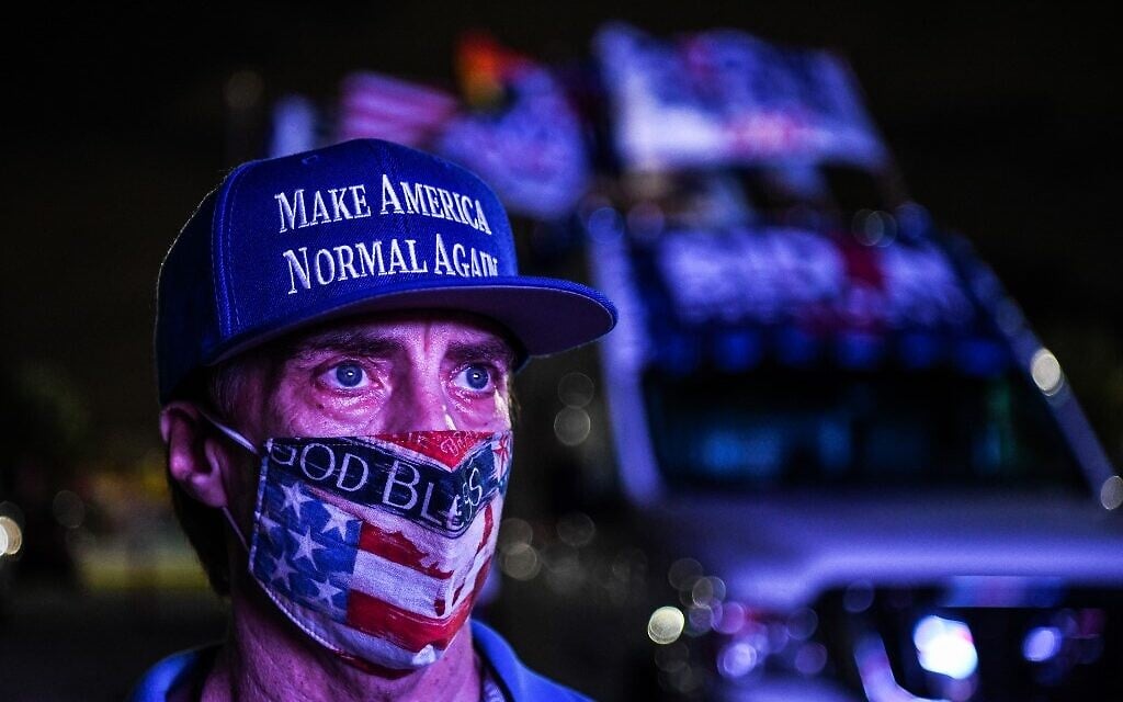 Andy Soberon a supporter of the Democratic party attends a watch party in Miami, Florida on November 3, 2020. (CHANDAN KHANNA / AFP)