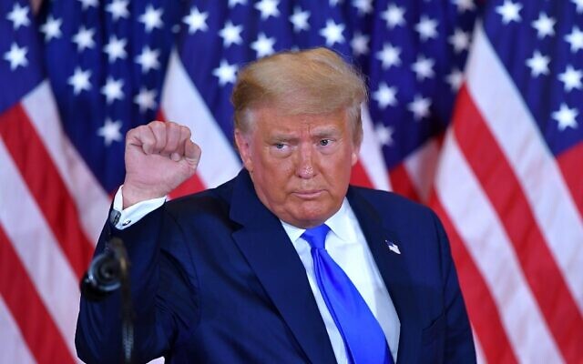 US President Donald Trump pumps his fist after speaking during election night in the East Room of the White House in Washington, DC, early on November 4, 2020. (MANDEL NGAN / AFP) US President Donald Trump pumps his fist after speaking during election night in the East Room of the White House in Washington, DC, early on November 4, 2020. (MANDEL NGAN / AFP)