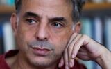Israeli writer and artist Etgar Keret during an interview with AFP at his home in Tel Aviv on November 5, 2020. (Photo by EMMANUEL DUNAND / AFP)