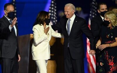 US President-elect Joe Biden and Vice President-elect Kamala Harris stand with spouses Jill Biden and Doug Emhoff after delivering remarks in Wilmington, Delaware, on November 7, 2020, after being declared the winners of the presidential election. (Photo by Jim WATSON / AFP)