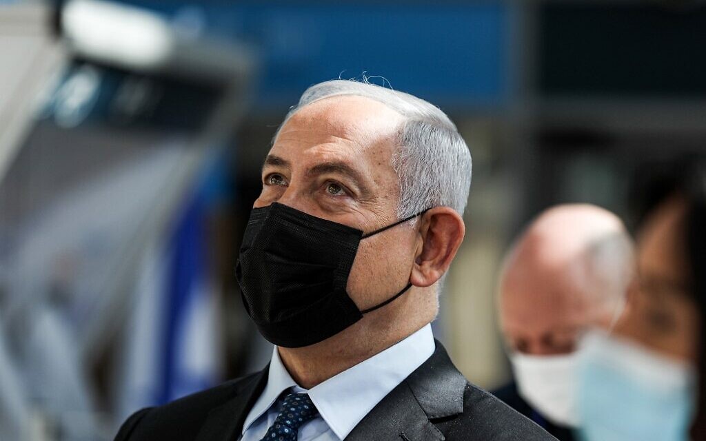 Prime Minister Benjamin Netanyahu at the inauguration of a COVID-19 rapid testing center at Ben Gurion International Airport in Lod on November 9, 2020. (Atef Safadi/ Pool/AFP) Prime Minister Benjamin Netanyahu at the inauguration of a COVID-19 rapid testing center at Ben Gurion International Airport in Lod on November 9, 2020. (Atef Safadi/ Pool/AFP)