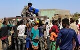 Ethiopians who fled their homes due to ongoing fighting are pictured at a refugee camp in the Hamdait border area of Sudan's eastern Kassala state, on November 12, 2020. (Photo by - / AFP)
