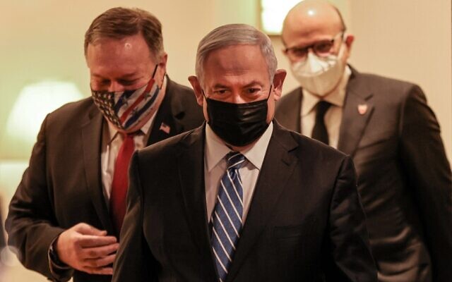 (L to R) US Secretary of State Mike Pompeo, Israeli Prime Minister Benjamin Netanyahu, and Bahrain's Foreign Minister Abdullatif bin Rashid Al Zayani, all mask-clad due to the COVID-19 coronavirus pandemic, arrive for a press conference after their trilateral meeting in Jerusalem on November 18, 2020. (Menahem KAHANA / POOL / AFP) (L to R) US Secretary of State Mike Pompeo, Israeli Prime Minister Benjamin Netanyahu, and Bahrain's Foreign Minister Abdullatif bin Rashid Al Zayani, all mask-clad due to the COVID-19 coronavirus pandemic, arrive for a press conference after their trilateral meeting in Jerusalem on November 18, 2020. (Menahem KAHANA / POOL / AFP)