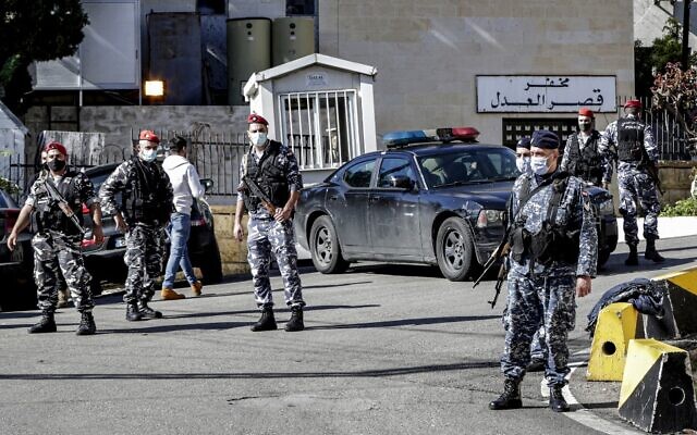 Policemen stand guard outside a detention center from which prisoners had fled earlier in Baabda, east of Lebanon's capital Beirut, on November 21, 2020. (Anwar Amro/AFP) Policemen stand guard outside a detention center from which prisoners had fled earlier in Baabda, east of Lebanon's capital Beirut, on November 21, 2020. (Anwar Amro/AFP)