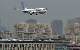 An airplane of budget airline Flydubai lands at Ben Gurion airport near Tel Aviv on November 26, 2020, on the first scheduled commercial service between the two cities, following the normalization of ties between the UAE and Israel. (JACK GUEZ / AFP)
