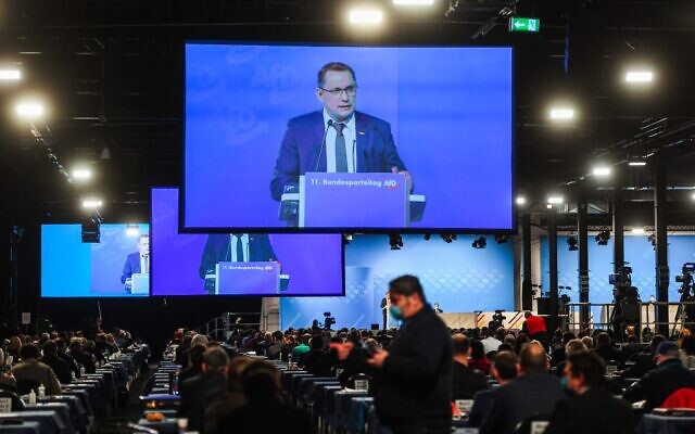 Tino Chrupalla, Federal Spokesperson, is seen on video screens during his speech at the Party Congress of farright AfD party at the Wunderland Kalkar, western Germany, on November 28, 2020. (INA FASSBENDER / AFP) Tino Chrupalla, Federal Spokesperson, is seen on video screens during his speech at the Party Congress of farright AfD party at the Wunderland Kalkar, western Germany, on November 28, 2020. (INA FASSBENDER / AFP)