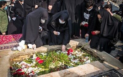 Iranian mourners attend the burial ceremony of slain nuclear scientist Mohsen Fakhrizadeh at Imamzadeh Saleh shrine in northern Tehran, on November 30, 2020. (HAMED MALEKPOUR / TASNIM NEWS / AFP)
