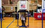 A voter casts a ballot at a polling station in New York City on November 1, 2020. (David Dee Delgado/Getty Images/AFP)