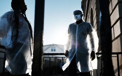 Workers at a COVID-19 testing location take a break in the Staten Island neighborhood of Tottenville on November 20, 2020 in New York City.(Spencer Platt/Getty Images/AFP)