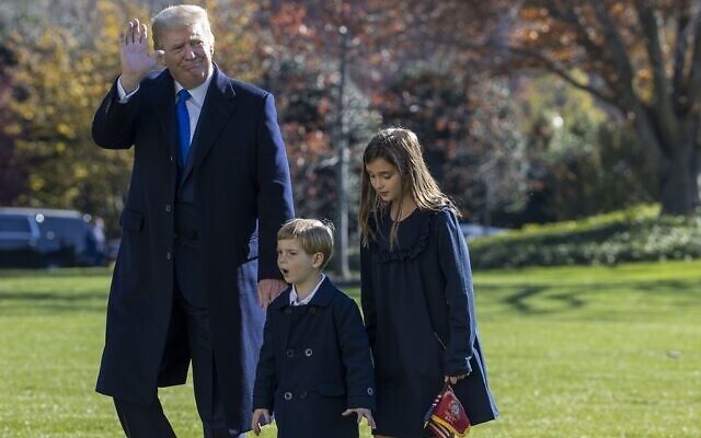 US President Donald Trump, followed by his grandchildren, Arabella Kushner and Theodore Kushner, walks on the south lawn of the White House on November 29, 2020, in Washington, DC. (Tasos Katopodis/Getty Images/AFP) US President Donald Trump, followed by his grandchildren, Arabella Kushner and Theodore Kushner, walks on the south lawn of the White House on November 29, 2020, in Washington, DC. (Tasos Katopodis/Getty Images/AFP)