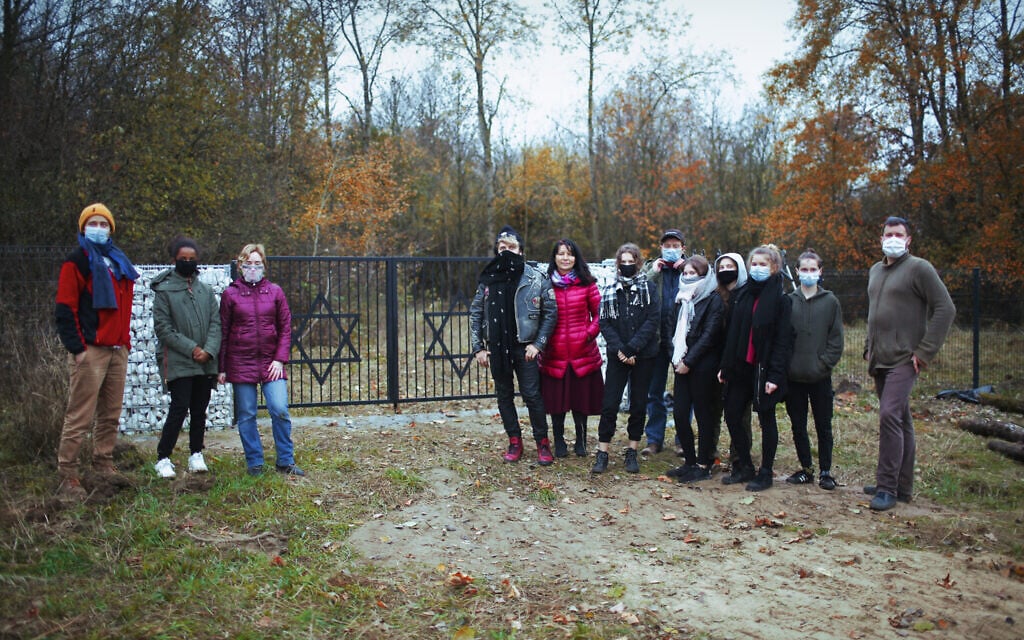 Michał Laszczkowski, right, with members of the Wagabunda Scouts troop,  November 11, 2020. (Pawel Czarnecki/ via JTA)