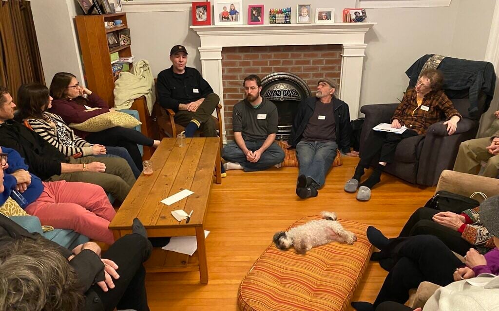 A group gathers in the Vancouver home of Noam and Val Dolgin to discuss a possible Jewish cohousing project. (Noam Dolgin/ via JTA)